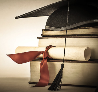 Graduation cap, diploma and books